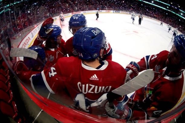 Nick Suzuki of the Montreal Canadiens celebrates his goal against the Tampa Bay Lightning with teammates during the second period of Game Three of...