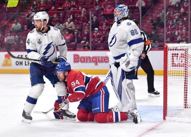 Jan Rutta and Corey Perry of the Montreal Canadiens look on as Andrei Vasilevskiy of the Tampa Bay Lightning tends goal during the third period in...
