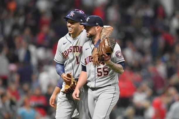 Carlos Correa and closing pitcher Ryan Pressly of the Houston Astros celebrate after the Astros defeated the Cleveland Indians at Progressive Field...