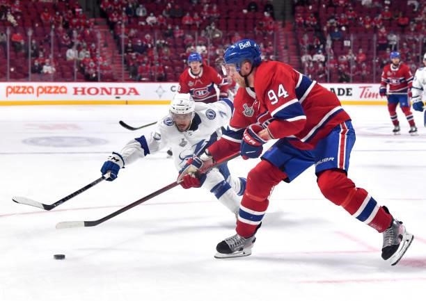 Corey Perry of the Montreal Canadiens controls the puck against Mathieu Joseph of the Tampa Bay Lightning during the third period in Game Three of...