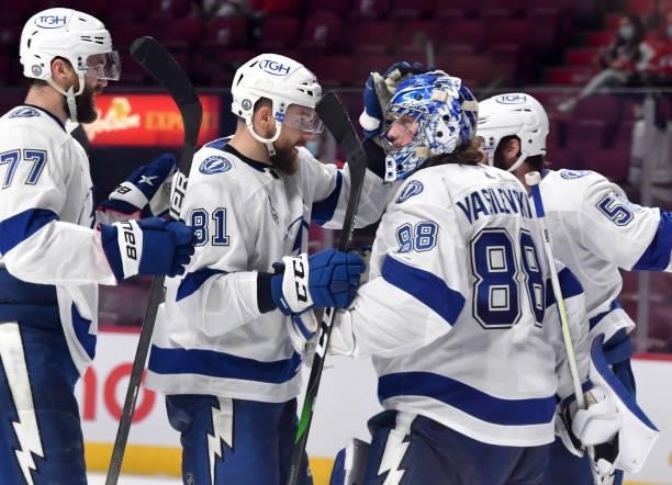 Erik Cernak congratulates Andrei Vasilevskiy after defeating the Montreal Canadiens 6-3 in Game Three of the 2021 NHL Stanley Cup Final at Bell...