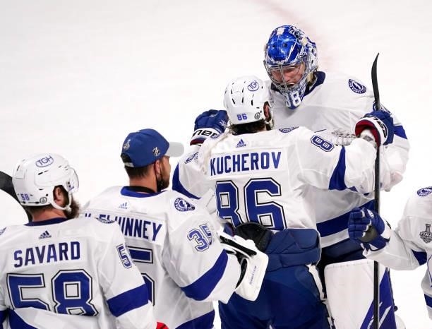 Nikita Kucherov congratulates Andrei Vasilevskiy of the Tampa Bay Lightning after defeating the Montreal Canadiens 6-3 in Game Three of the 2021 NHL...