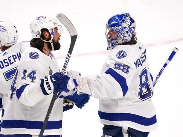 Pat Maroon congratulates Andrei Vasilevskiy of the Tampa Bay Lightning after defeating the Montreal Canadiens 6-3 in Game Three of the 2021 NHL...