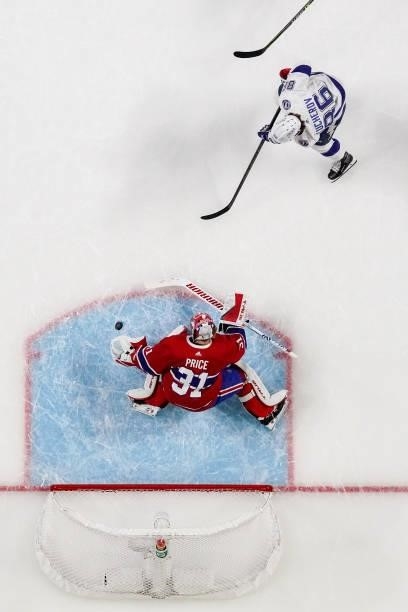 Carey Price of the Montreal Canadiens makes the save against Nikita Kucherov of the Tampa Bay Lightning during the first period in Game Three of the...