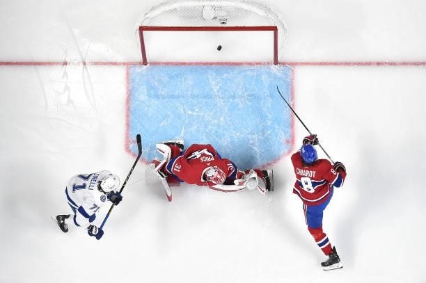 Carey Price of the Montreal Canadiens allows a goal to Victor Hedman of the Tampa Bay Lightning as Anthony Cirelli looks on during the first period...