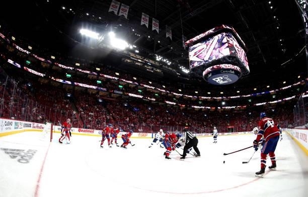 The Montreal Canadiens and the Tampa Bay Lightning face off during the third period of Game Three of the 2021 Stanley Cup Final at Bell Centre on...