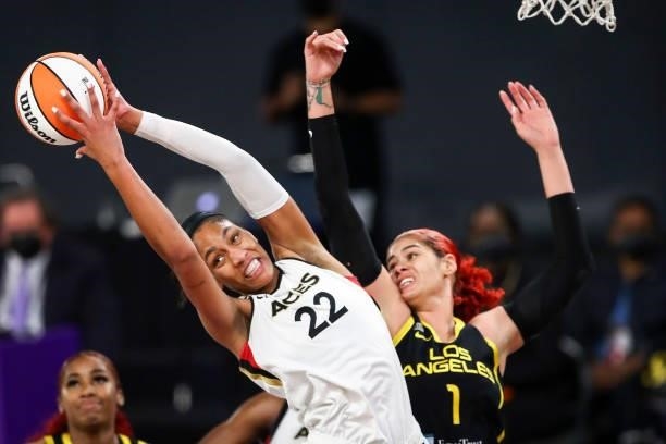 Forward A'ja Wilson of the Las Vegas Aces gets the rebound ahead of center Amanda Zahui B of the Los Angeles Sparks in the second half at Los Angeles...