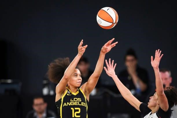 Forward Nia Coffey of the Los Angeles Sparks shoots while defended by forward Dearica Hamby of the Las Vegas Aces in the second half at Los Angeles...
