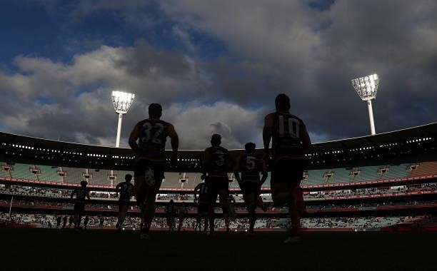 The Demons head out after the break during the round 16 AFL match between Melbourne Demons and Greater Western Sydney Giants at Melbourne Cricket...