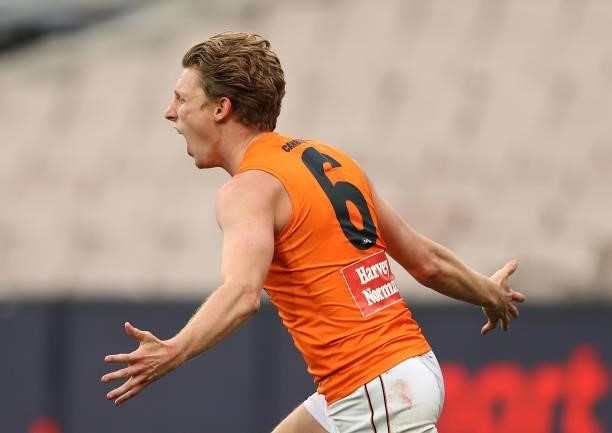Lachie Whitfield of the Giants celebrates after scoring a goal during the round 16 AFL match between Melbourne Demons and Greater Western Sydney...