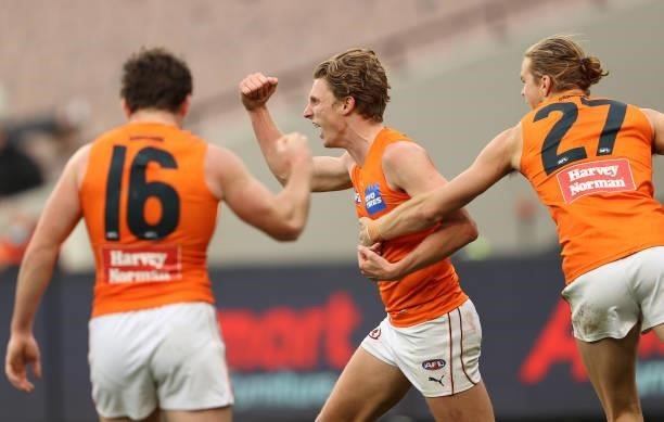 Lachie Whitfield of the Giants celebrates after scoring a goal during the round 16 AFL match between Melbourne Demons and Greater Western Sydney...