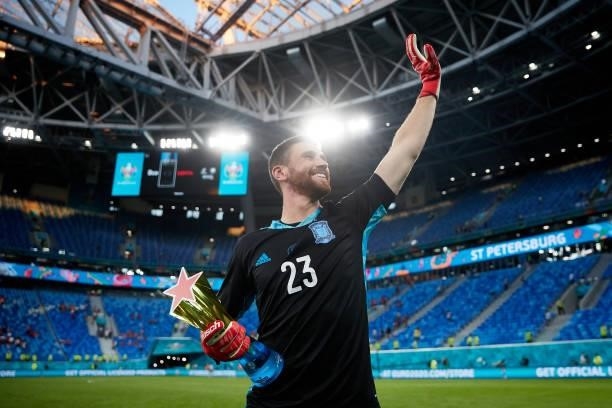 Goalkeeper Unai Simon of Spain celebrates with the star of the Match trophy after winning the UEFA Euro 2020 Championship Quarter-final match between...