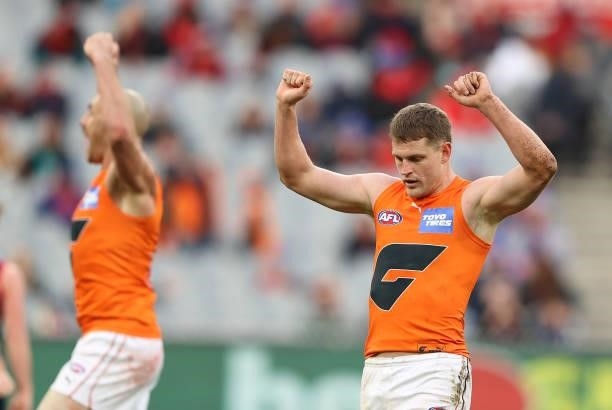 Jacob Hopper of the Giants celebrates on the siren after the Giants defeated the Demons during the round 16 AFL match between Melbourne Demons and...