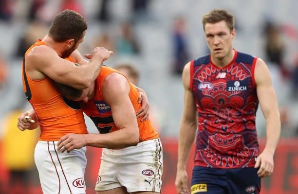 Sam J. Reid and Jacob Hopper of the Giants celebrate after the Giants defeated the Demons during the round 16 AFL match between Melbourne Demons and...