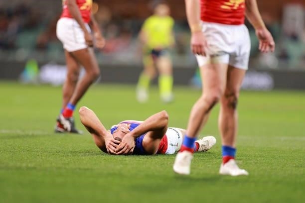 Brandon Starcevich of the Lions lays on the ground during the round 16 AFL match between Adelaide Crows and Brisbane Lions at Adelaide Oval on July...