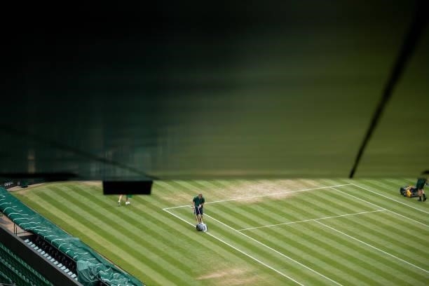 Ground Staff prepare Centre Court during Day Six of The Championships - Wimbledon 2021 at All England Lawn Tennis and Croquet Club on July 03, 2021...