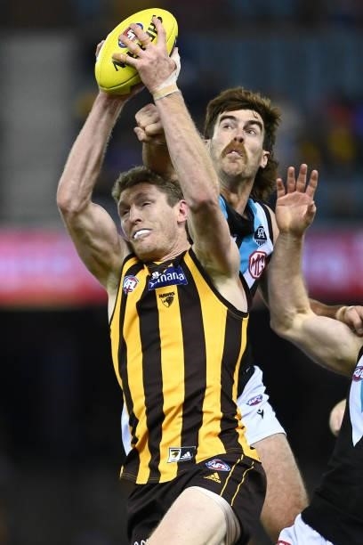 Ben McEvoy of the Hawks marks infront of Scott Lycett of the Power during the round 16 AFL match between Hawthorn Hawks and Port Adelaide Power at...