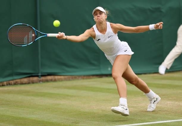 Magda Linette of Poland hits a forehand during her Ladies' Singles third Round match against Paula Badosa of Spain during Day Six of The...