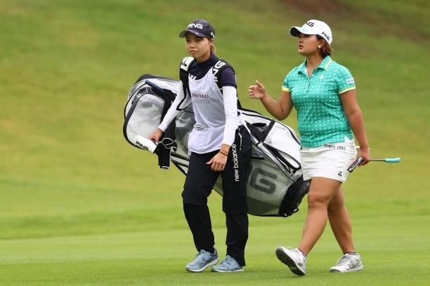 Ai Suzuki of Japan talks with her caddie on the 1st hole during the first round of the Shiseido Ladies Open at Totsuka Country Club on July 3, 2021...