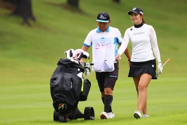 Ayaka Watanabe of Japan talks with her caddie on the 1st hole during the first round of the Shiseido Ladies Open at Totsuka Country Club on July 3,...