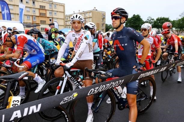 Nans Peters of France and AG2R Citroën Team & Richie Porte of Australia and Team INEOS Grenadiers & The Peloton at start during the 108th Tour de...