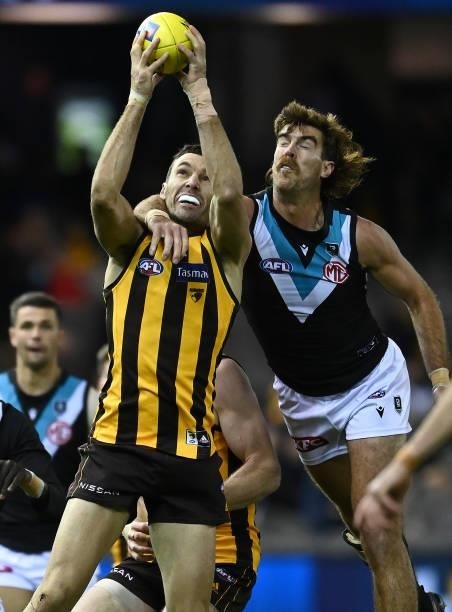 Jonathon Ceglar of the Hawks marks infront of Scott Lycett of the Power during the round 16 AFL match between Hawthorn Hawks and Port Adelaide Power...
