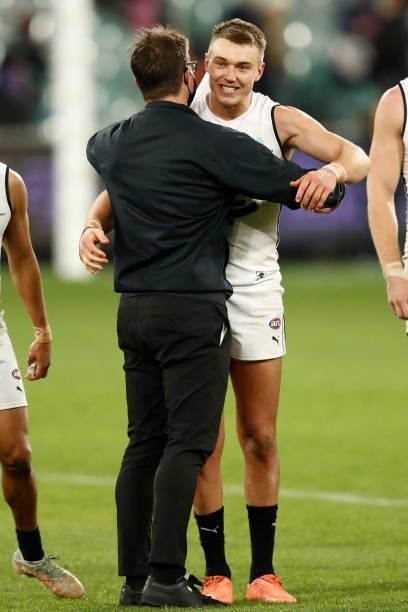 David Teague, senior coach of Carlton and captain Patrick Cripps embrace after the round 16 AFL match between Fremantle Dockers and Carlton Blues at...