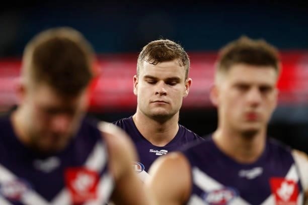 Dejected Fremantle players walk from the ground after the round 16 AFL match between Fremantle Dockers and Carlton Blues at the Melbourne Cricket...