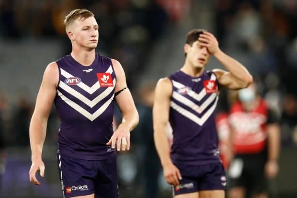 Dejected Fremantle players walk from the ground after the round 16 AFL match between Fremantle Dockers and Carlton Blues at the Melbourne Cricket...