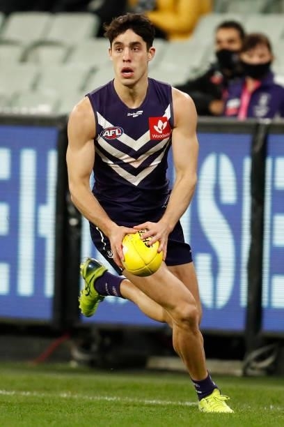 Adam Cerra of the Dockers runs with the ball during the round 16 AFL match between Fremantle Dockers and Carlton Blues at the Melbourne Cricket...