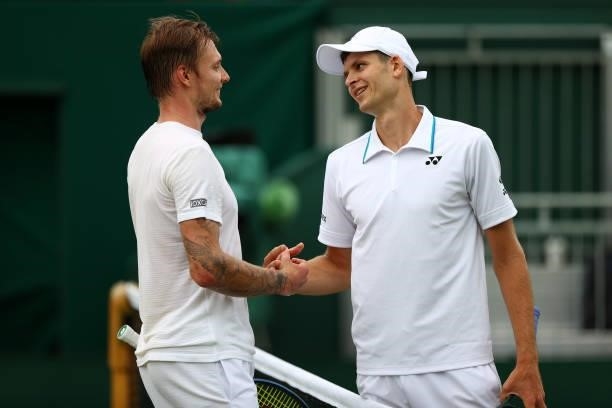 Hubert Hurkacz of Poland interacts with Alexander Bublik of Kazakhstan after victory in the men's singles third round match on during Day Six of The...