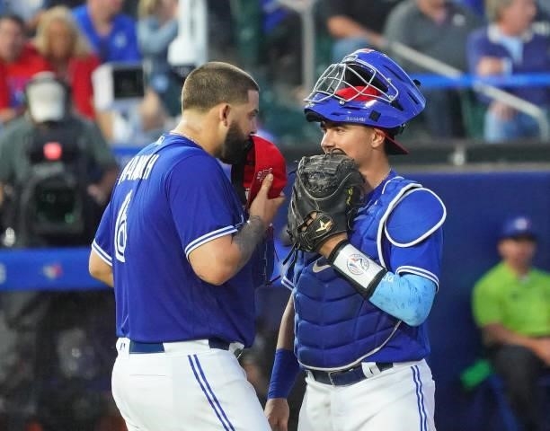 Alek Manoah of the Toronto Blue Jays and Reese McGuire talk during the game against the Tampa Bay Rays at Sahlen Field on July 2, 2021 in Buffalo,...