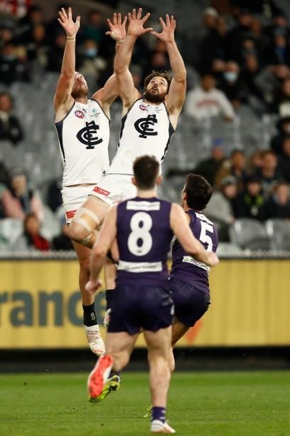 Harry McKay and Levi Casboult of the Blues leap for the ball during the round 16 AFL match between Fremantle Dockers and Carlton Blues at the...