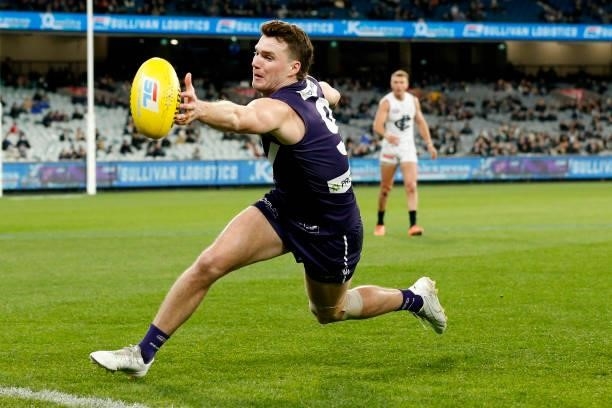 Blake Acres of the Dockers lunges for the ball during the round 16 AFL match between Fremantle Dockers and Carlton Blues at the Melbourne Cricket...