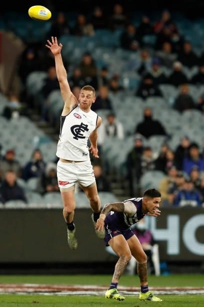 Liam Jones of the Blues leaps for ther ball during the round 16 AFL match between Fremantle Dockers and Carlton Blues at the Melbourne Cricket Ground...
