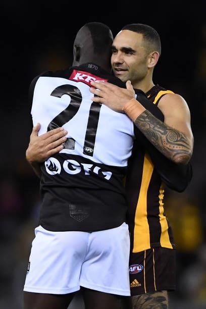 Aliir Aliir of the Power and Shaun Burgoyne of the Hawks hug at the end of the match during the round 16 AFL match between Hawthorn Hawks and Port...