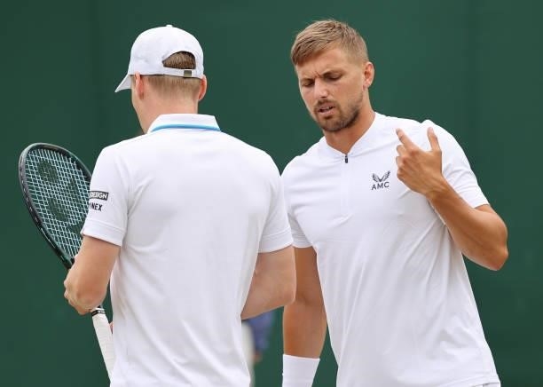 Lloyd Glasspool of Great Britain interacts with partner Harri Heliovaara of Finland during their men's doubles second round match against Alastair...