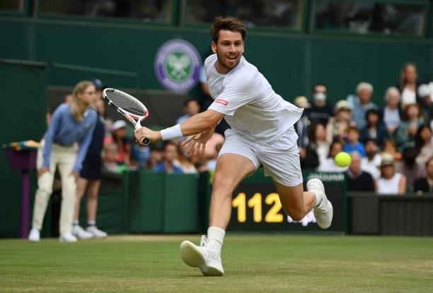 Cameron Norrie of Great Britain plays a backhand during his men's singles third round match against Roger Federer of Switzerland during Day Six of...