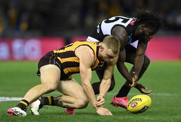 James Worpel of the Hawks and Martin Frederick of the Power compete for the ball during the round 16 AFL match between Hawthorn Hawks and Port...