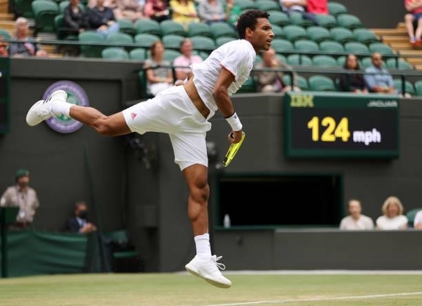 Felix Auger Aliassime of Canada serves during his men's singles third round match against Nick Kyrgios of Australia during Day Six of The...