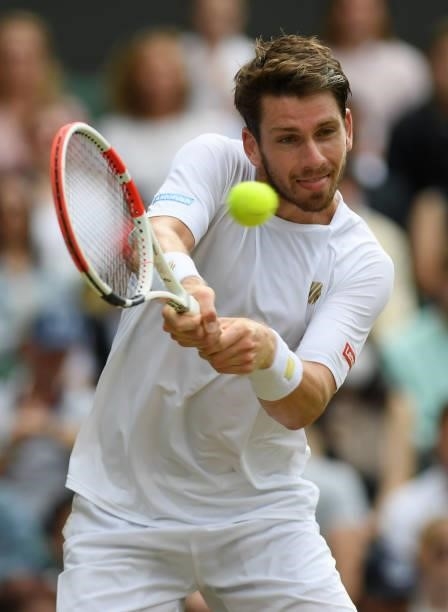 Cameron Norrie of Great Britain plays a backhand during his men's singles third round match against Roger Federer of Switzerland during Day Six of...