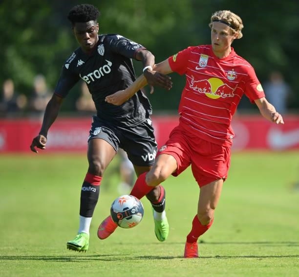 Aurelien Tchouameni of AS Monaco and Maurits Kjaergaard of FC Red Bull Salzburg compete for the ball during the Pre-Season Friendly match between FC...