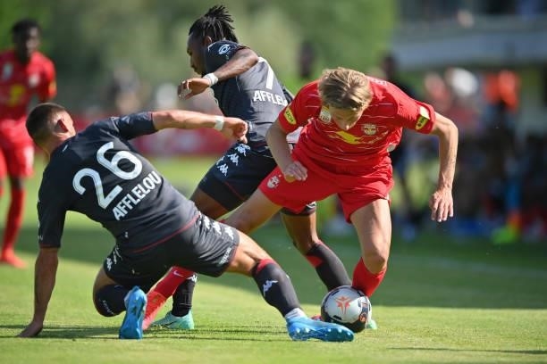 Ruben Aguilar and Gelson Batalha Martins of AS Monaco challenge Maurits Kjaergaard of FC Red Bull Salzburg for the ball during the Pre-Season...