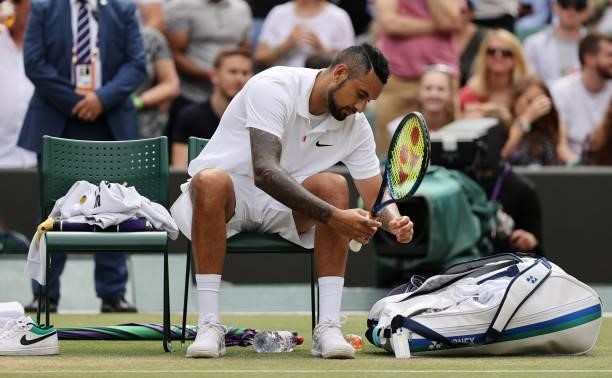Nick Kyrgios of Australia reacts after retiring injured during his men's singles third round match against Felix Auger Aliassime of Canada during Day...