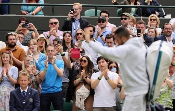 The crowd apllaud Nick Kyrgios of Australia off after retiring injured during his men's singles third round match against Felix Auger Aliassime of...