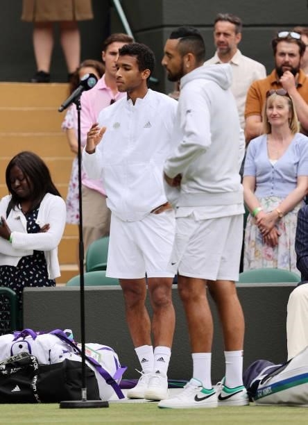 Nick Kyrgios of Australia and Felix Auger Aliassime of Canada are interviewed after Kyrgios retired due to injury during his men's singles third...