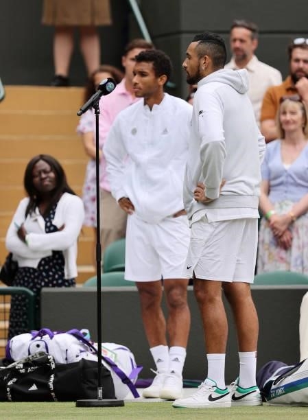 Nick Kyrgios of Australia and Felix Auger Aliassime of Canada are interviewed after Kyrgios retired due to injury during his men's singles third...