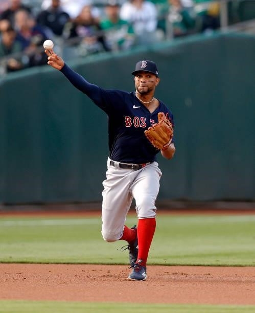 Xander Bogaerts of the Boston Red Sox throws to first base against the Oakland Athletics at RingCentral Coliseum on July 02, 2021 in Oakland,...