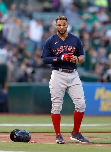 Xander Bogaerts of the Boston Red Sox takes off his gloves after striking out against the Oakland Athletics at RingCentral Coliseum on July 02, 2021...