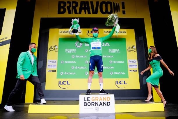 Mark Cavendish of The United Kingdom and Team Deceuninck - Quick-Step Green Points Jersey celebrates at podium during the 108th Tour de France 2021,...
